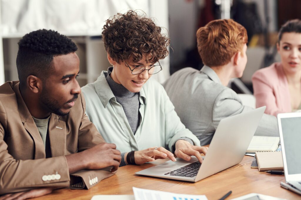 Two people working on the computer